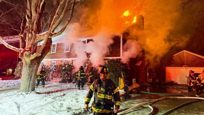 A Reading house fire injured a resident and a firefighter after the hoarding conditions blocked attack