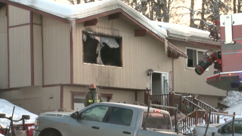 East Anchorage house fire sends person to hospital, two dogs to emergency vet