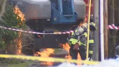 Massive response to Queen Anne fire after crane hits power lines; operator trapped for hours