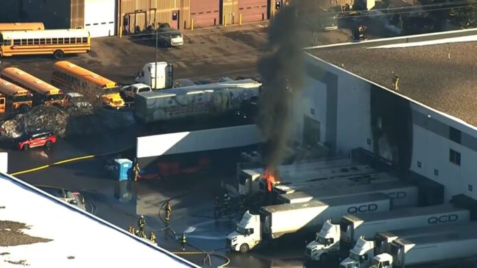 Roseville firefighters rescue an employee as fire spreads from tractor-trailer to building