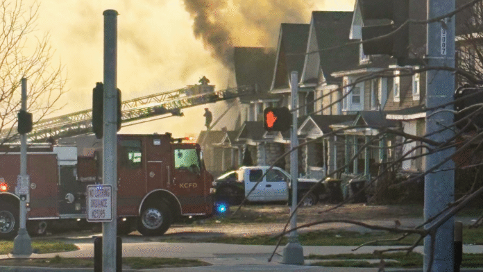 Kansas City firefighters rescue person from roof of burning abandoned house