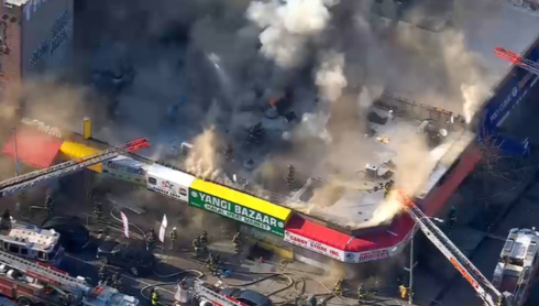 VIDEOS: Fire tears through building housing row of businesses in New York