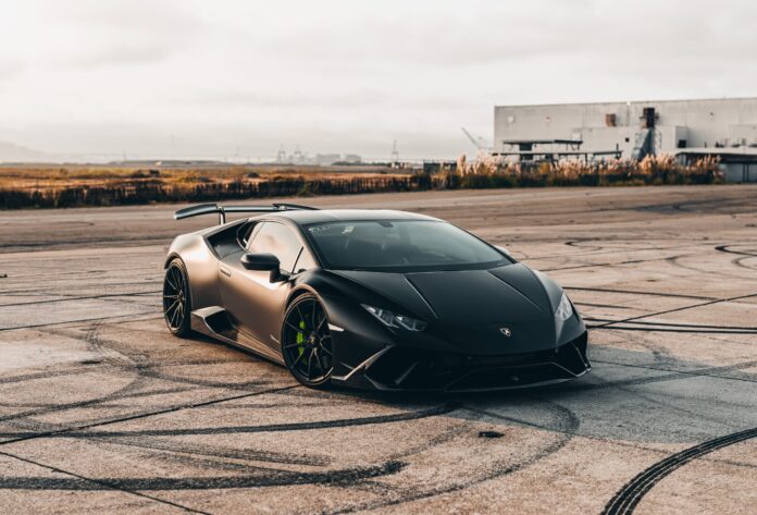 Florida Woman Drives Elevated Pickup Over Lamborghini Sports Car in Parking Lot