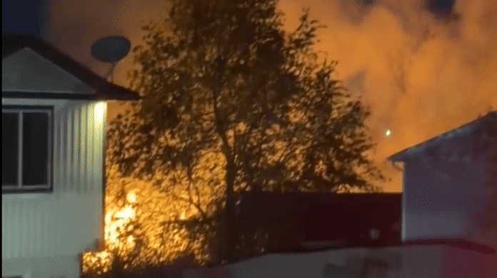 Phragmites catch fire in Ogden melting siding of nearby home