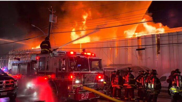 Queens lumberyard fire reaches five alarms as FDNY deploys 300 firefighters to battle blaze