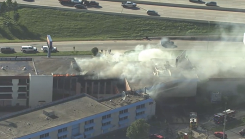 Firefighters battle building fire near Yale and I-44 in Tulsa