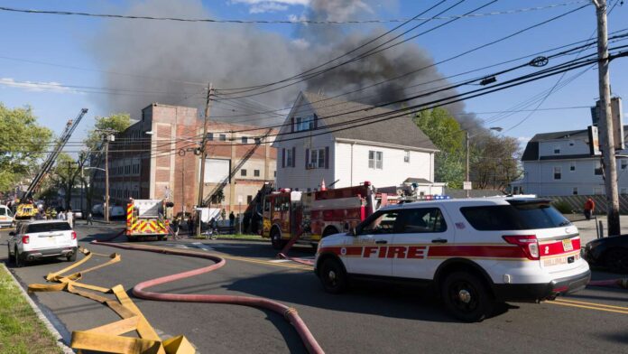 Massive Belleville warehouse fire spreads to nearby buildings amid strong winds